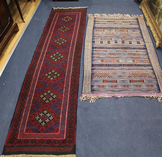 A red ground rug and another 250 x 62cm, 150 x 94cm